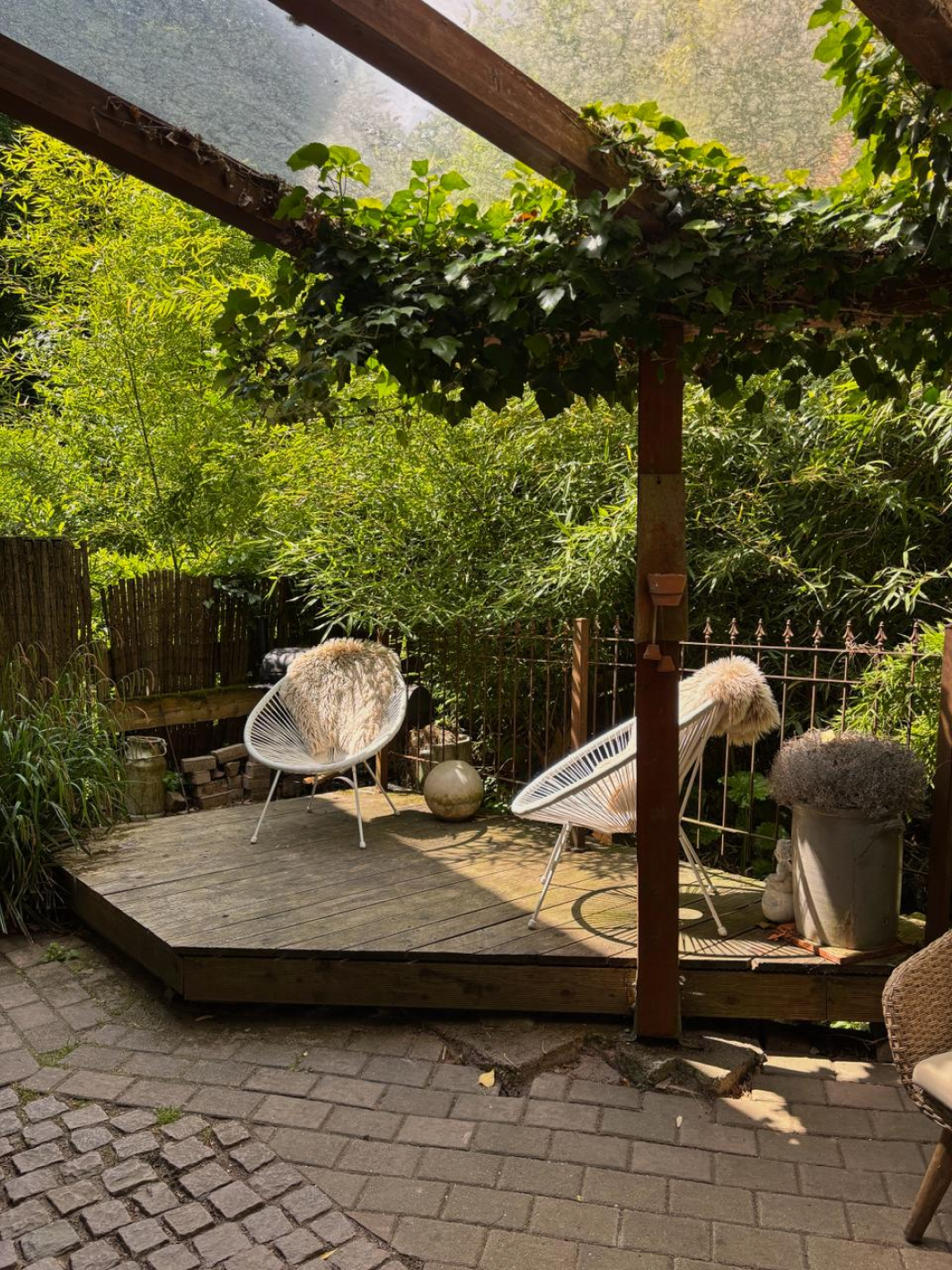 Cozy outdoor deck with string chairs