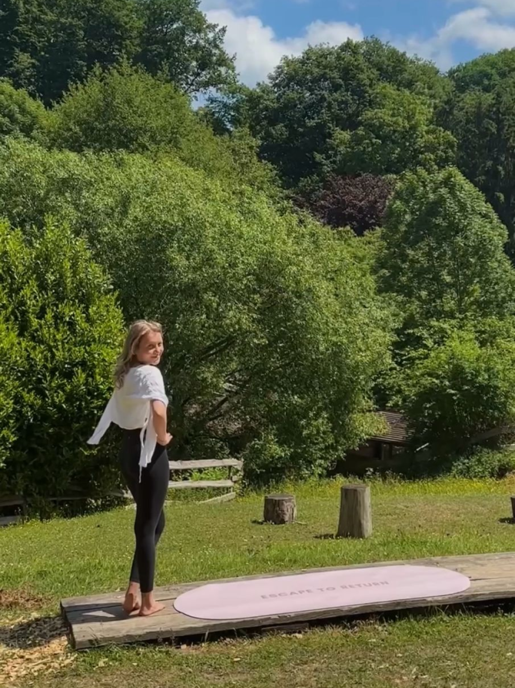 Woman practicing yoga outdoors