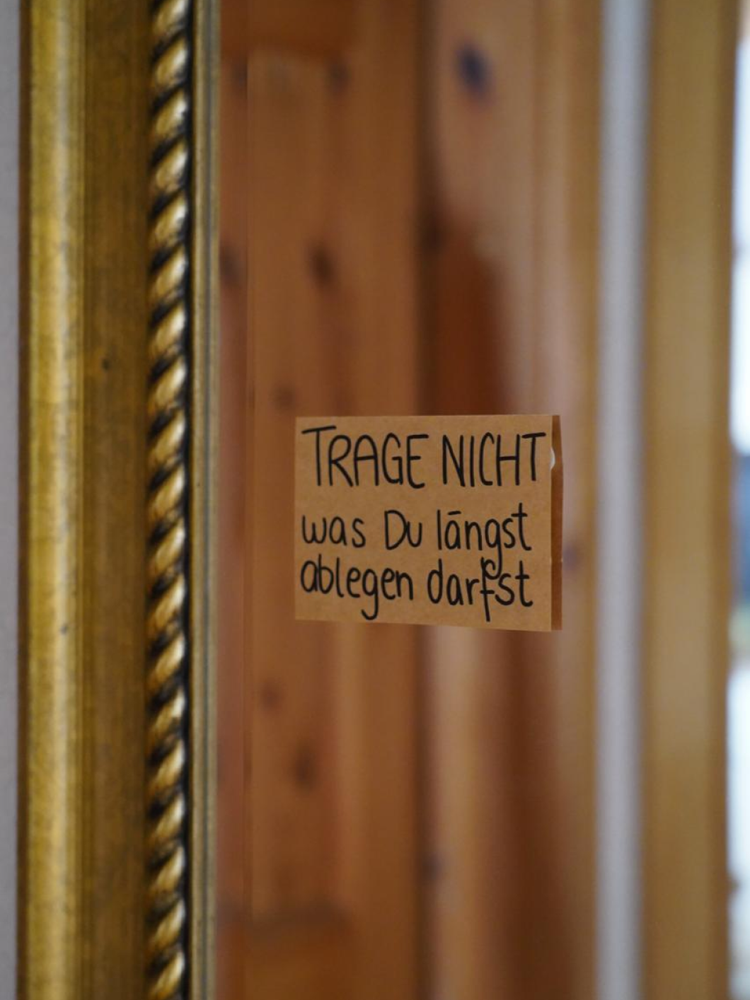 Mindfulness note on wooden door frame